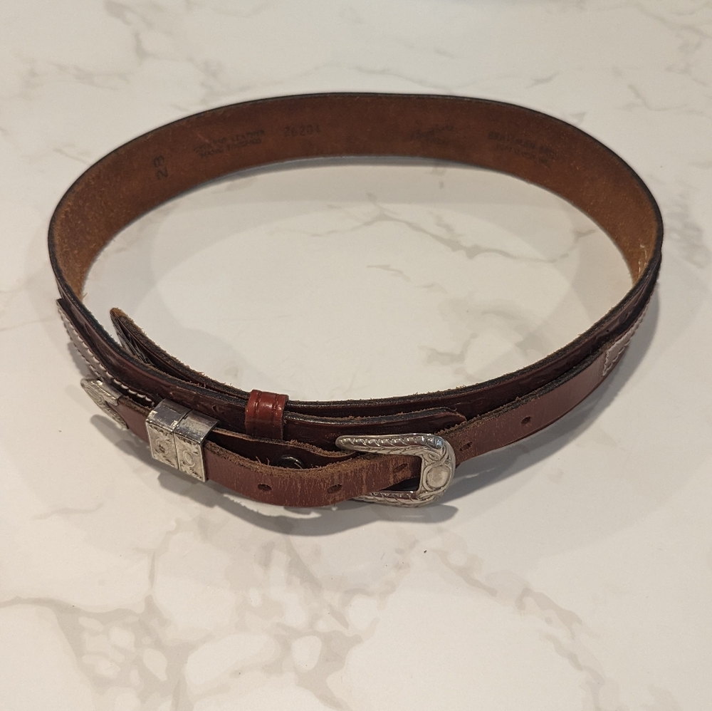 Hand finish leather belt with silver metal accents
